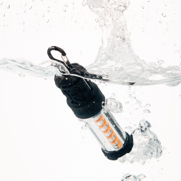 mosquito repellent camp light submerged in water showing how waterproof it is
